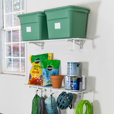 Pair of Bristol 1' x 4' white wall-mounted garage shelves, sturdy and easy to install for organized storage.