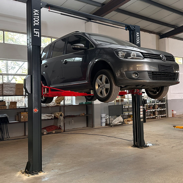 Katool KT-AS110D 11,000 lb Two-Post Asymmetrical Vehicle Lift with Single-Point Lock Release — KT-AS110D 11000 lbs 2 Post Asymmetrical Arm Vehicle Lift and KT-MP2 Lift Height Extensions (Set of 4)