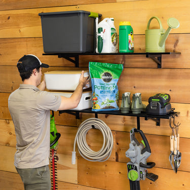 Pair of Bristol 1' x 4' wall-mounted garage shelves with sturdy metal brackets and wooden shelves for organized storage.