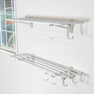 Set of two Bristol white 1x4 foot wall-mounted garage shelves for organized storage and durable wall mounting.