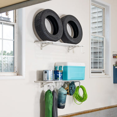 Two white Bristol 1' x 4' wall-mounted garage shelves with sturdy brackets for organized storage.