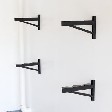 StoreYourBoard heavy-duty wall mounted brackets for 1' x 4' DIY garage shelves, sturdy steel construction for garage storage.